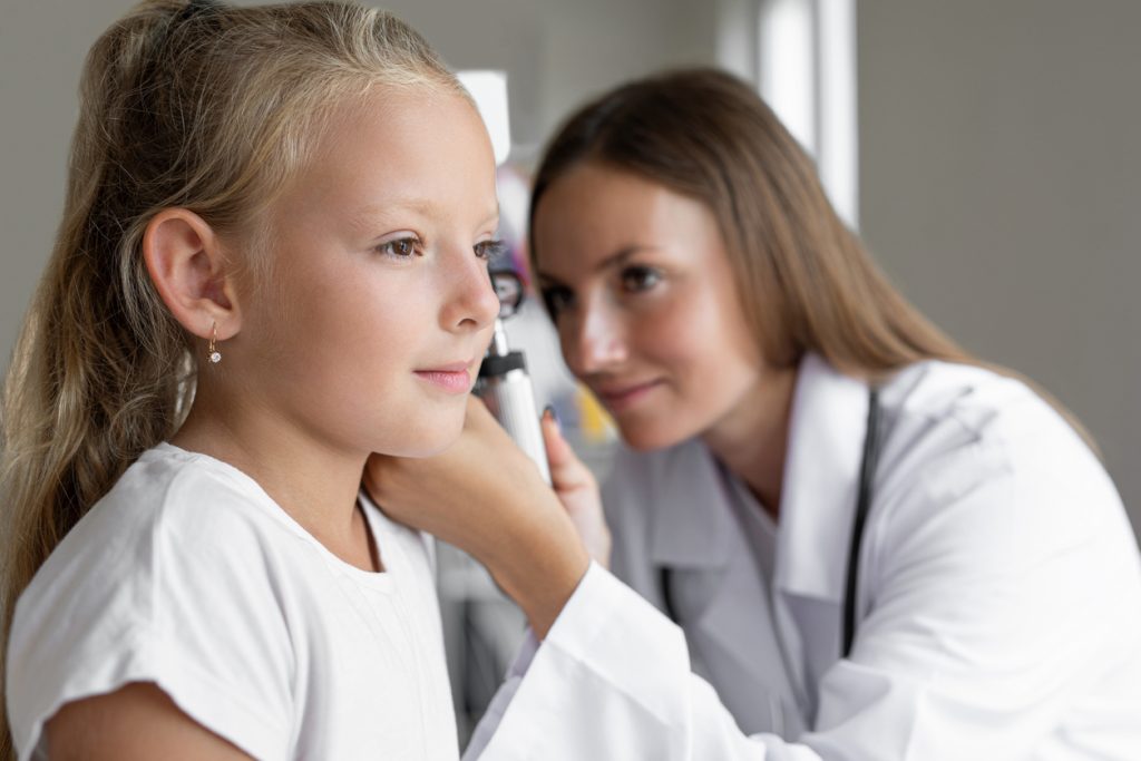 girl being examined by doctor
